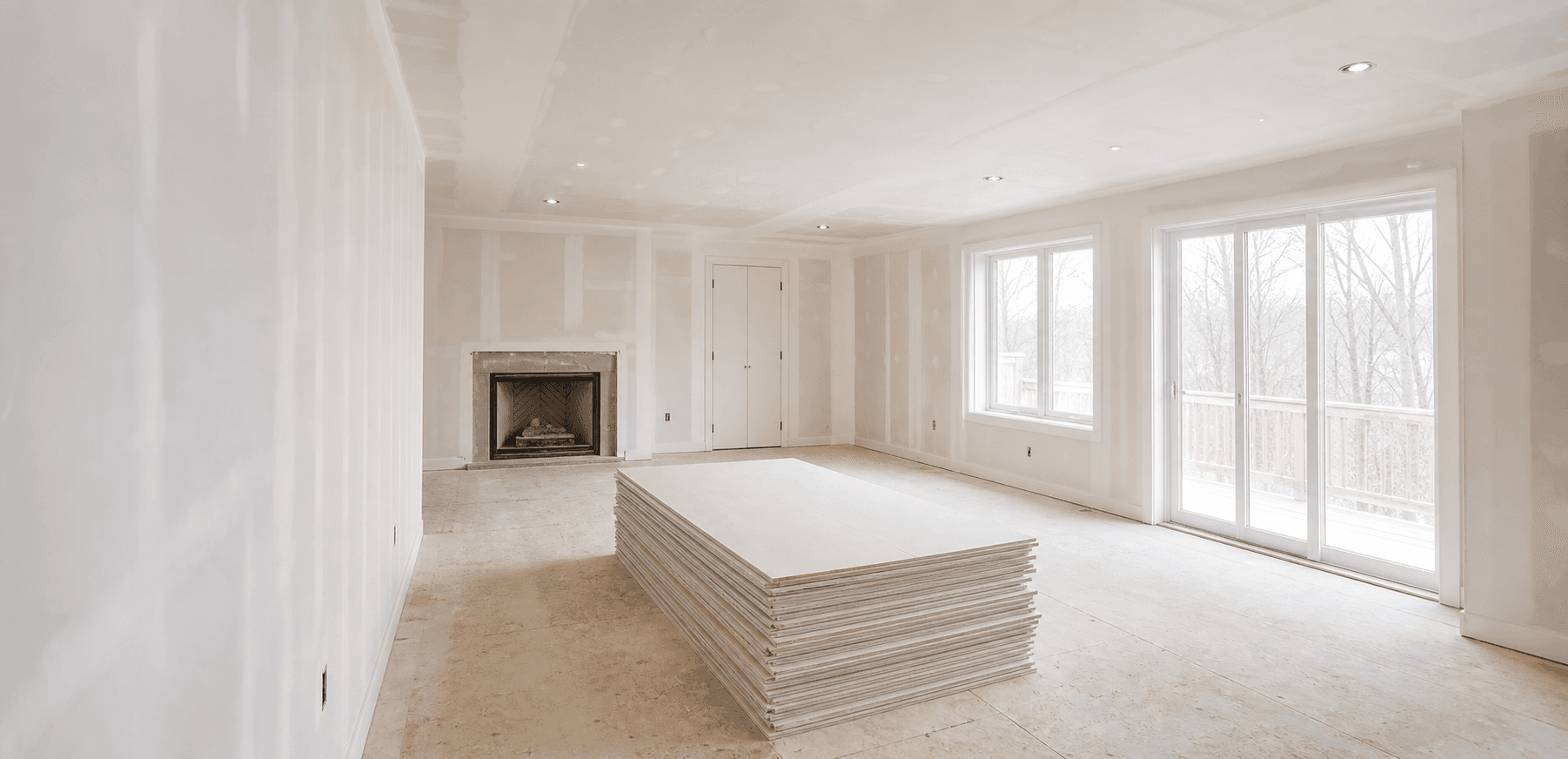 Bright newly drywalled room ready for finishing